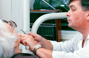 Dentist performing dental treatment